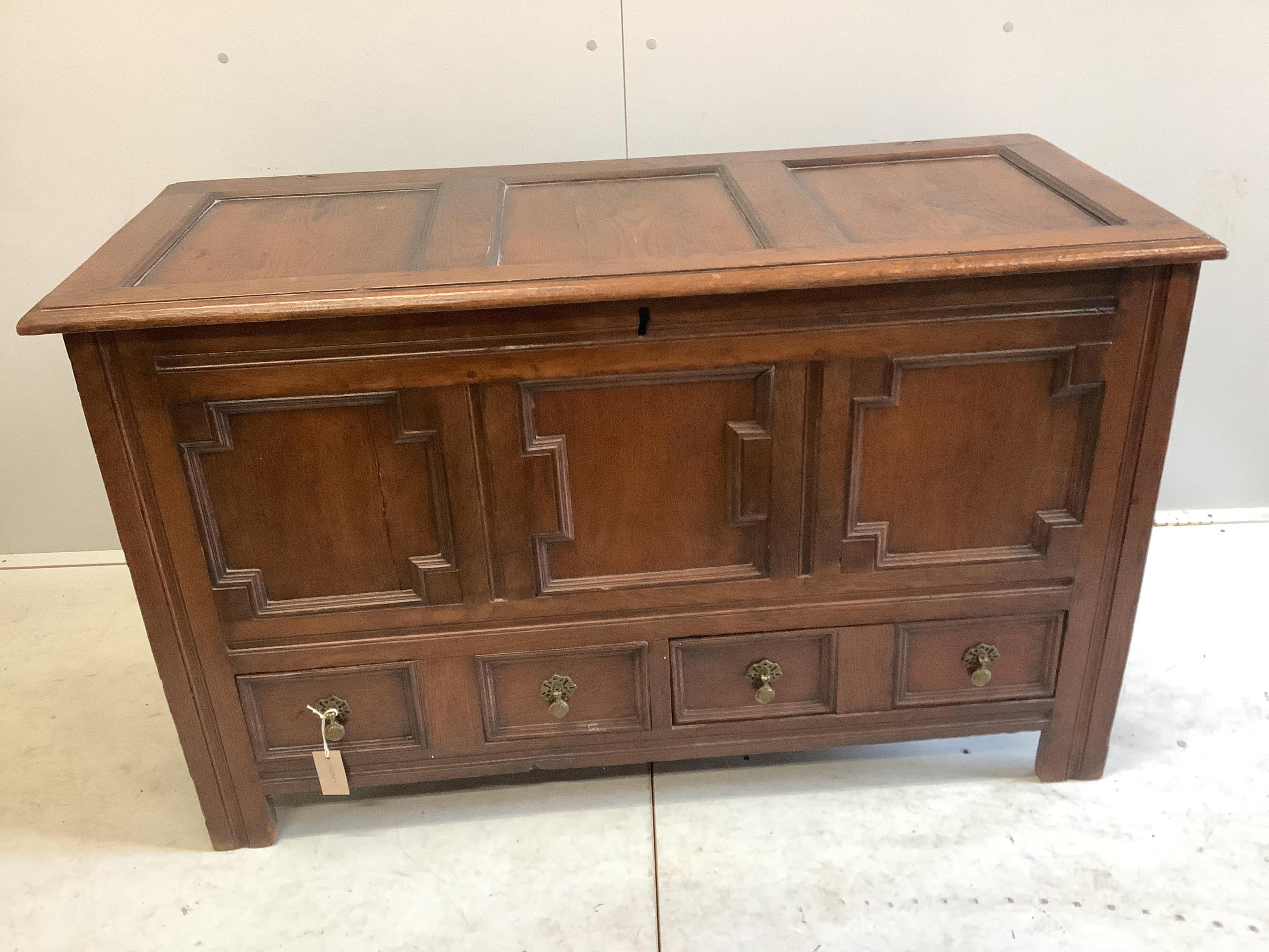 An 18th century panelled oak mule chest, width 126cm, depth 54cm, height 76cm. Condition - fair